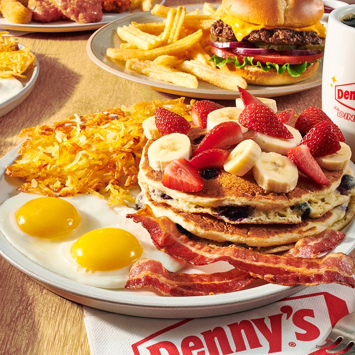 Denny’s menu items — pancakes, burger, and branded napkins